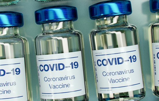 Vials of COVID-19 vaccine, in a row