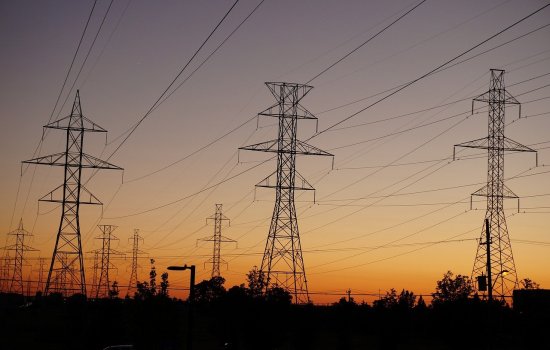 Photo of powerlines at sunset.