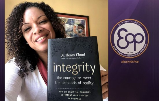 A smiling woman with curly brown hair holds a book "integrety: the courage to meet the demads of reality" by Dr. Henry Cloud. Next to her is the EOP logo