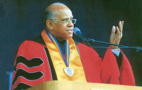 Leonard Slade, in regalia, speaks at a UAlbany Commencement