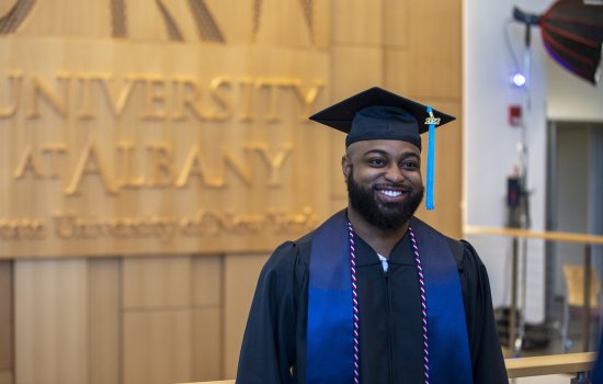 A person wearing a graduation cap and gown