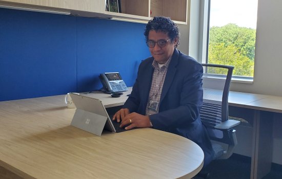 Jorge E. González-Cruz sits at his desk inside ETEC.