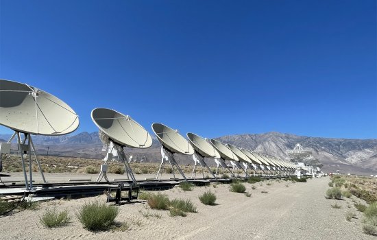 a row of radio astronomy telescopes at the Deep Synoptic Array at Owens Valley Radio Observatory.