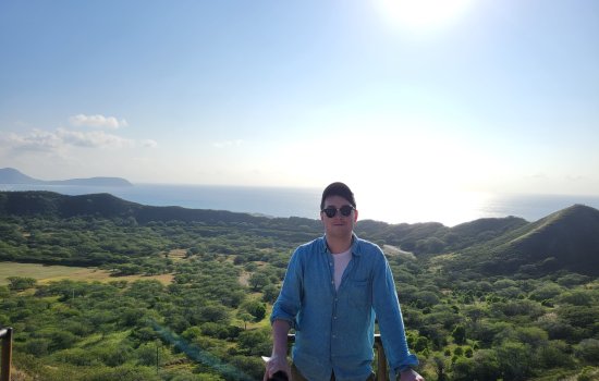 John Angles hiking in the mountains.