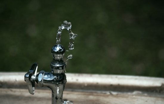 Drinking water fountain spurts water