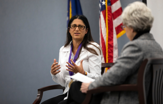 Mona Hanna-Attisha in a chair next to Mary Gallant as she speaks about her work on the Flint water crisis.