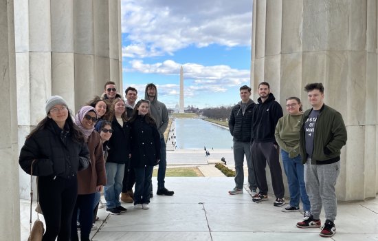 UAlbany's Semester in Washington cohort stand in front of the Washington Monument.