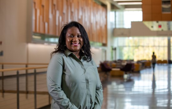 CEHC's DeeDee Bennett Gayle stands in the atrium at the ETEC research and development complex.