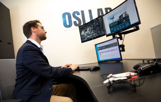 CEHC's Stephen Coulthart views three monitors inside the OSI lab at ETEC.