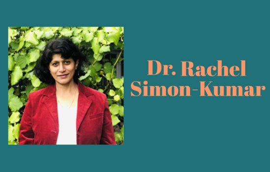 Teal graphic featuring a photo of Dr. Rachel Simon-Kumar, with short dark hair and a red blazer standing in front of greenery on the left. On the right is peach text that reads, 'Dr. Rachel Simon-Kumar'.