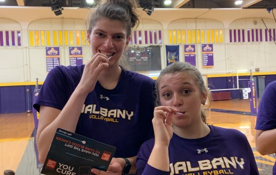 UAlbany volleyball players Danielle Tedesco (left) and Anna Chalupa taking the swab test in 2021.