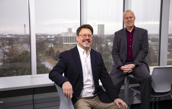 Eric Stern and Chris Thorncroft sit in ETEC's weather observation deck on a rainy day.