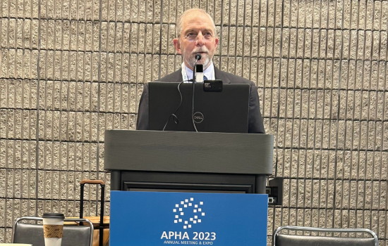 David Hoffman stands behind a podium at APHA 2023.