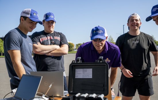 ASRC's Jeff Freedman joins students to review weather balloon data in real time from a laptop in the ETEC parking lot.