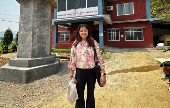 Labika Baral stands outside of her internship site.