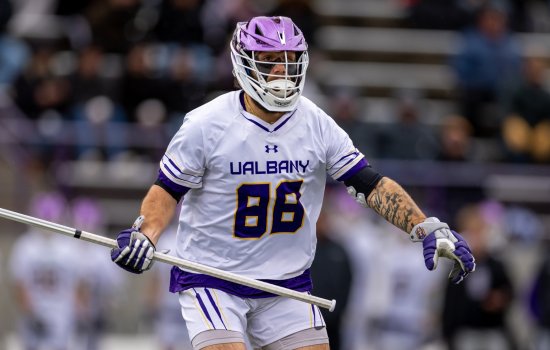 UAlbany longstick defenseman Jake Piseno on the field at Tom and Mary Casey Stadium.
