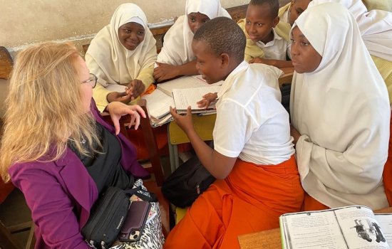 Angel Ford meets with a group of students inside a classroom on Pemba Island, Tanzania.