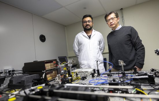 University at Albany Department of Nanoscale Science & Engineering Professor Mengbing Huang and doctoral student Sahyadri Anil Patil demonstrate a reliable ion implantation cladding method for sapphire optics fiber.