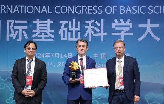 UAlbany Professor of Matheamtics Antun Milas, center, receives an award from the 2024 ICB Congress in Beijing. (Photo provided))