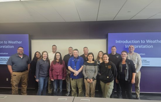 Graduates of the State Weather Risk Communication Center microcredential pose for a class photo.