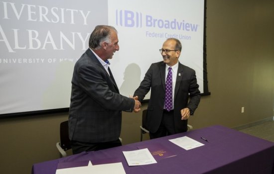 UAlbany President Havidán Rodríguez (r) and Broadview CEO Michael J. Castellana (l) sign agreement offering a set of three certificate programs beginning this fall