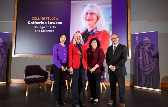 Provost Carol Kim, Professor Catherine Lawson, College of Arts and Sciences Dean Jeanette Altarriba and President Havidán Rodríguez pose for a photo in front of a projector screen, which shows a photo of Professor and the words, “Collins Fellow, Catherine Lawson, College of Arts and Sciences."