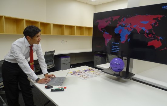 Ariel Pinto reviews a heat map displaying the global spread of malware attacks from the Cyber Risk Lab at ETEC.