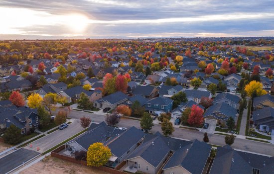 An aerial view of a larger neighborhood in autumn.