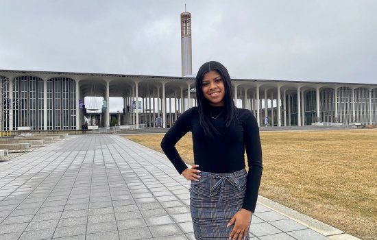 Photo of Ariana Barrett on the Entry Plaza of the Uptown Campus.