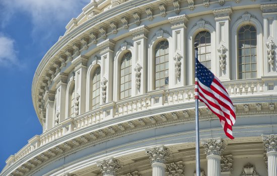 An American Flag waves outside U.S. Capitol Building 