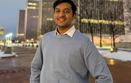 UUlbany graduate student Pallav Savaliya stands in front of the Empire State Plaza.