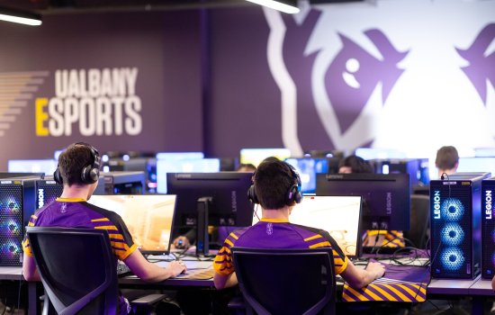 Students play PC games from inside the UAlbany Esports arena.