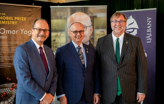 Omar Yaghi stands with UAlbany President Havidán Rodríguez and Hudson Valley President Michael Brophy 