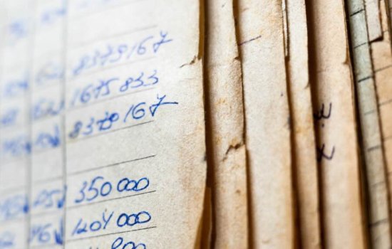 Archived papers stacked together. 