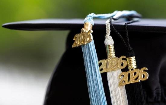Photo of a graduate's cap with 2026 tassels