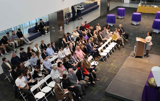 Dean Paquita Davis-Friday speaks to an audience of students and loved ones during the third annual Graduating Student Achievement Awards.