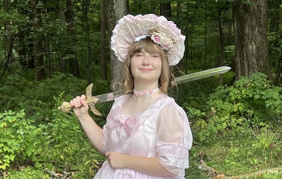 Sophie Breunig holds up a sword used as part of the UAlbany Living History Club.