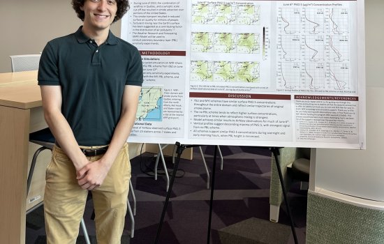 Ryan Sontarp stands in front of his poster at Showcase 2026.