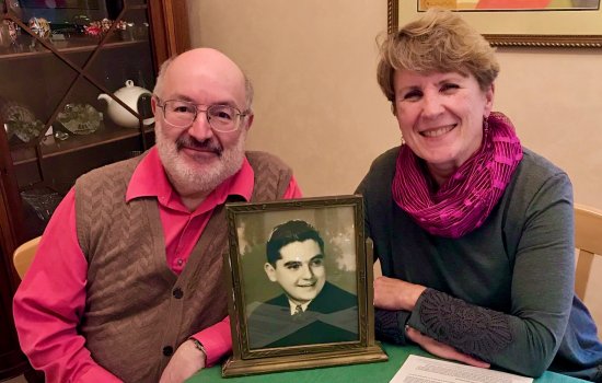 Robert & Diana Bangert-Drowns with a photo of Bob's uncle, Fr. Martin