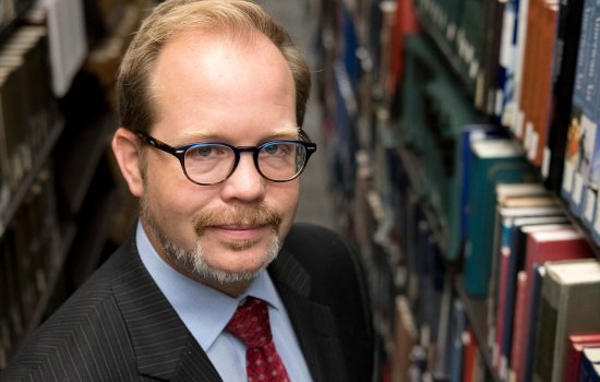 Dean Jason E. Lane in library