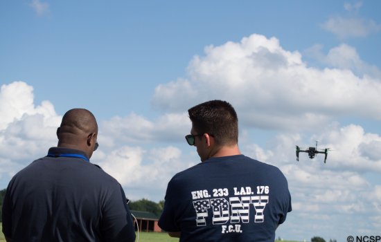 Expert working with emergency manager on UAS flight