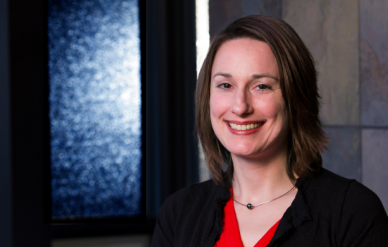 Woman smiling at camera.