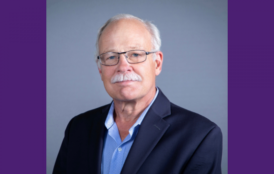 Man smiling at the camera.