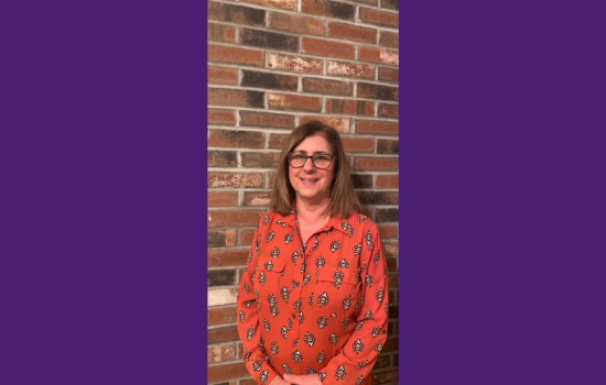 Woman smiling at camera.