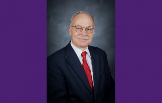 Man smiling at the camera.