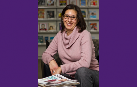 Photo of a woman smiling at the camera.
