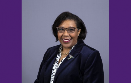 Woman smiling at the camera.