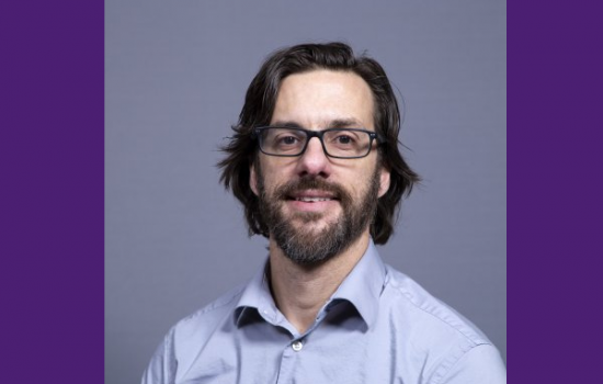 Man smiling at the camera.