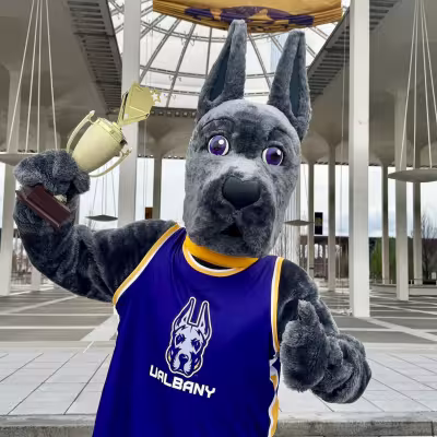 Damien the Great Dane with a trophy in front of the podium