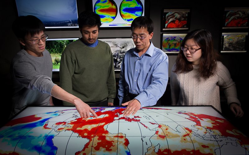 UAlbany atmospheric scientist Liming Zhou and student researchers 